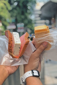 Midsection of person holding ice cream