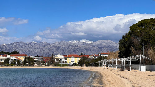 An april view over vrsi beach towards mount velebit ,with some peaks still covered with snow. 