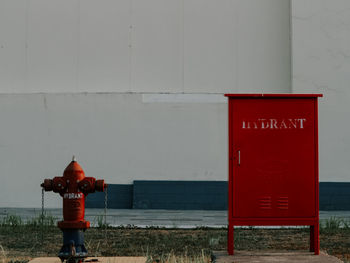 Red information sign on wall