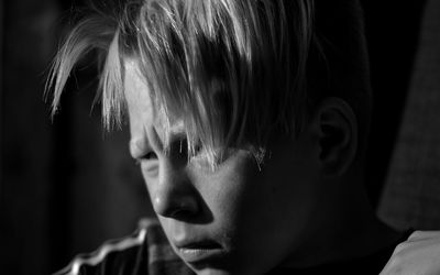 Close-up of boy looking away