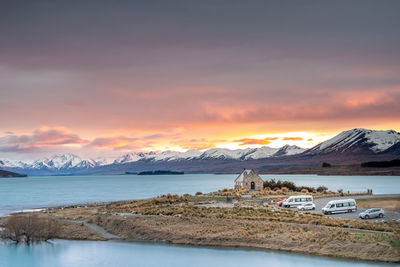 Sunrise view of the church of good shepherd with beautiful snow capped mountain range. 