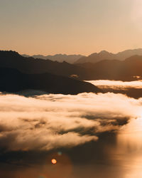 Scenic view of silhouette mountains against sky during sunset