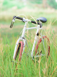 Close-up of bicycle on field