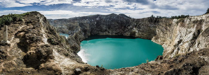 Panoramic shot of sea and rocks against sky