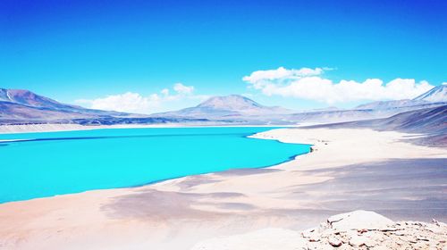 Scenic view of mountain against blue sky