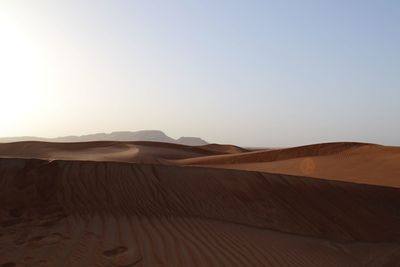 Scenic view of desert against clear sky