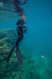 Man swimming in sea