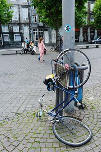 Bicycle against building in city