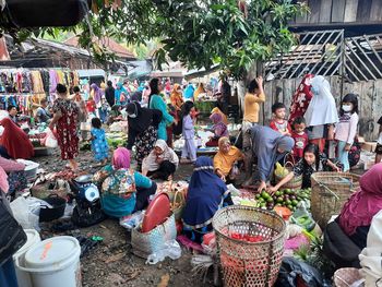 Group of people at market stall