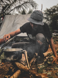 Midsection of man preparing food