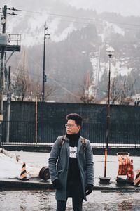 Young man in boat on snow