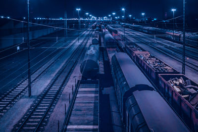 High angle view of freight train at night