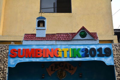 Low angle view of text on building
