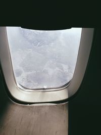 View of landscape seen through train window