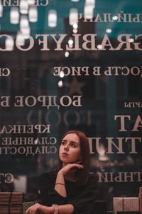 Portrait of a young woman looking away