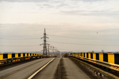 Railroad tracks against sky during sunset