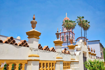 Low angle view of traditional building against clear blue sky