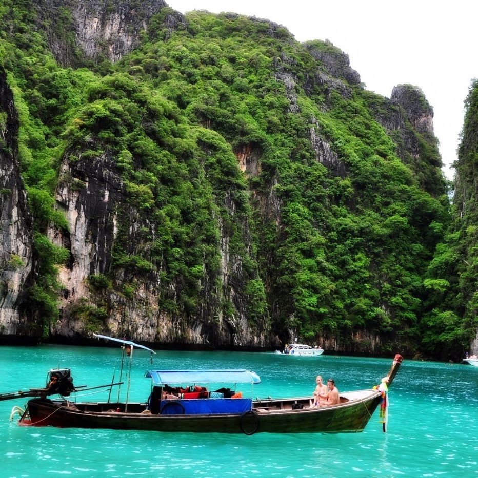 water, nautical vessel, boat, transportation, tree, mode of transport, waterfront, tranquil scene, tranquility, sea, beauty in nature, nature, scenics, travel, vacations, mountain, sailing, men, day