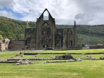 Old ruin building against cloudy sky