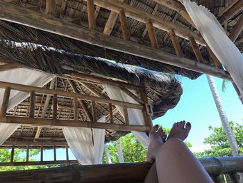 Low angle view of person on roof of building