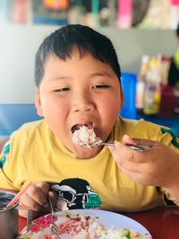 Close-up of boy eating food