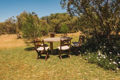 Camping chairs and a table on a fire place in the wild at naivasha, kenya