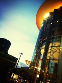 Low angle view of buildings against sky at dusk