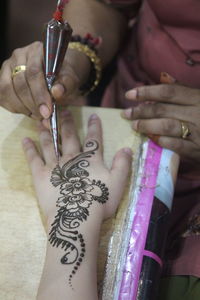 Close-up of woman holding hands