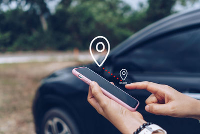 Close-up of hand holding car