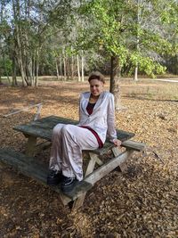 Portrait of woman sitting on table