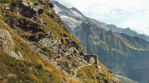 Scenic view of mountains against sky with hiking path