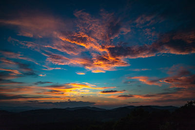 Low angle view of dramatic sky during sunset