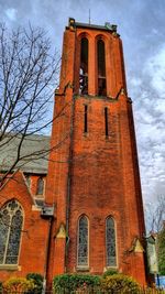 Low angle view of bell tower against sky