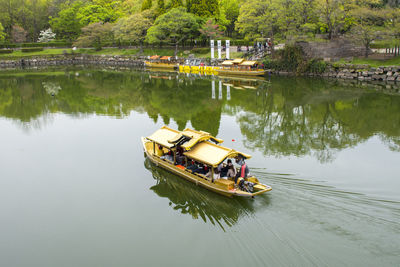 Touristic boats along the moat of osaka castle one of best activities experience around osaka castle
