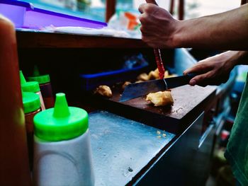 Midsection of person preparing food