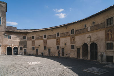 Exterior of old building against sky in city