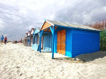 Beach huts against sky