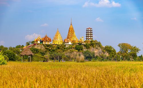 Scenic view of temple field against sky