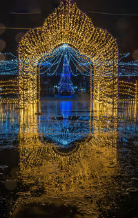 Digital composite image of illuminated building at night