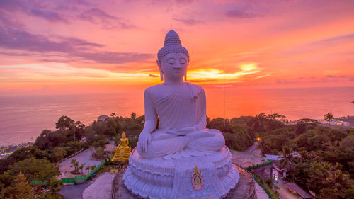 Statue against sky during sunset