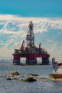 View of ship in sea against sky