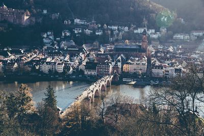 High angle view of city by river