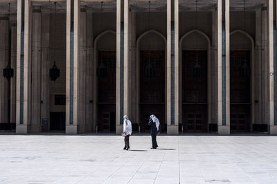 People at entrance of building