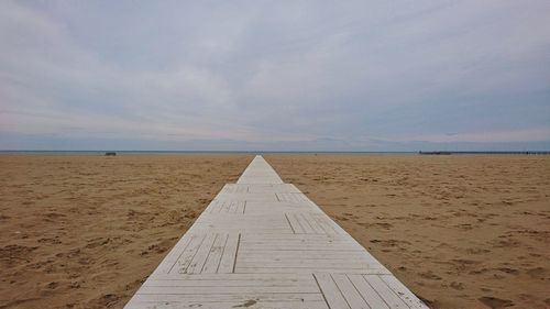 View of tire tracks on beach