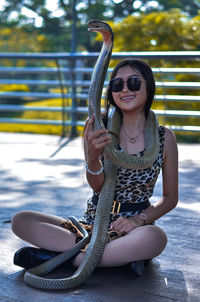 Girl with king cobra
