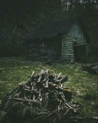 Abandoned wooden house on field