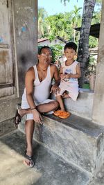 Side view of boy playing in yard