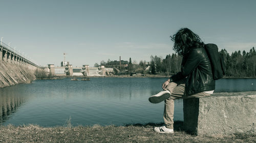 Man standing on riverbank