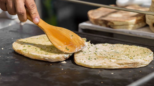 Close-up of person preparing food