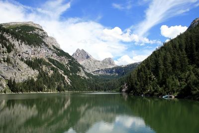 Scenic view of lake and mountains against sky